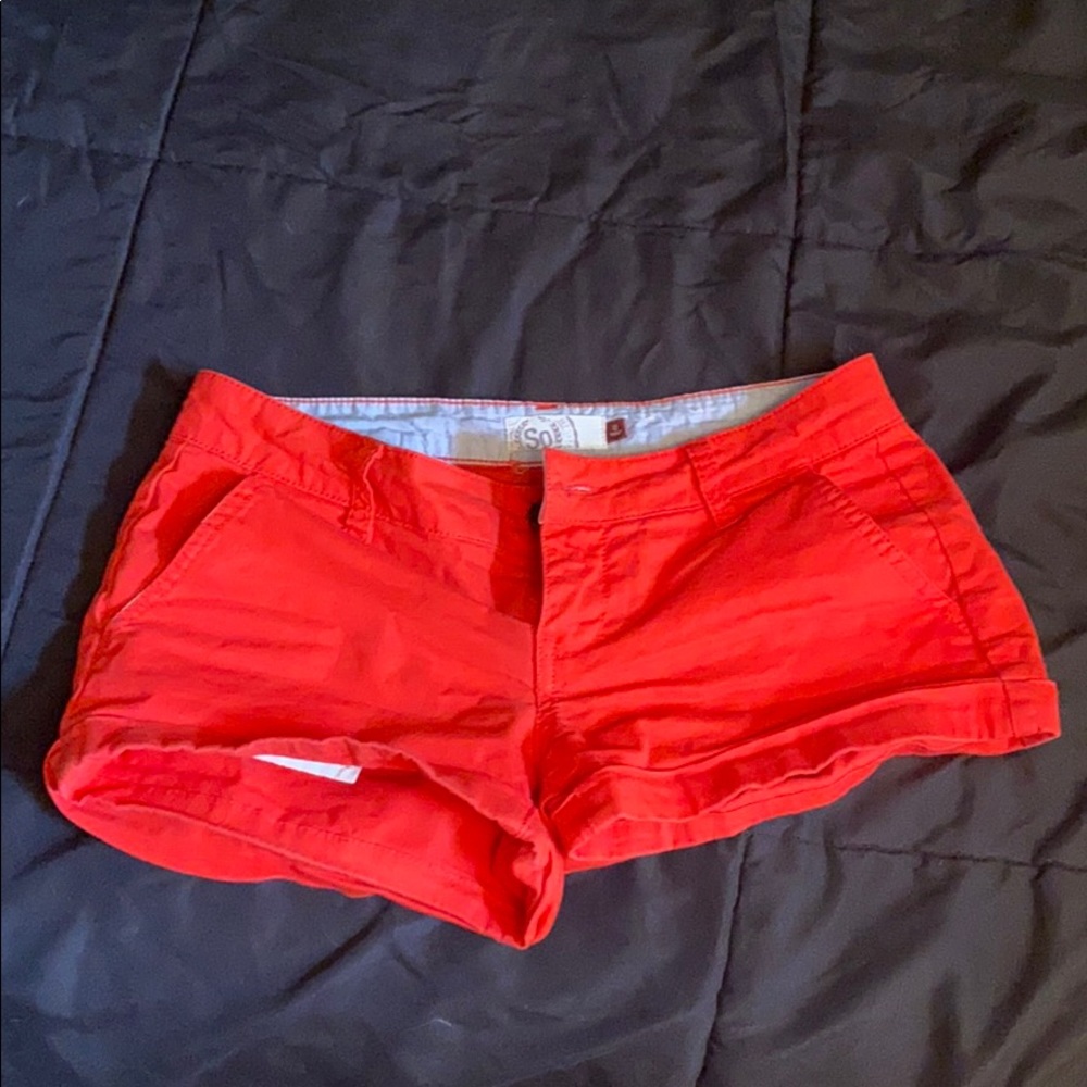Neon red shorts